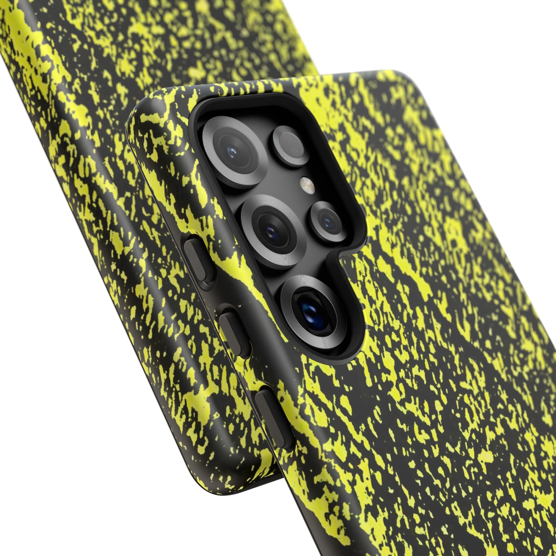 Close-up of a smartphone case with a black and neon yellow splatter pattern, shown on a phone against a white background.
