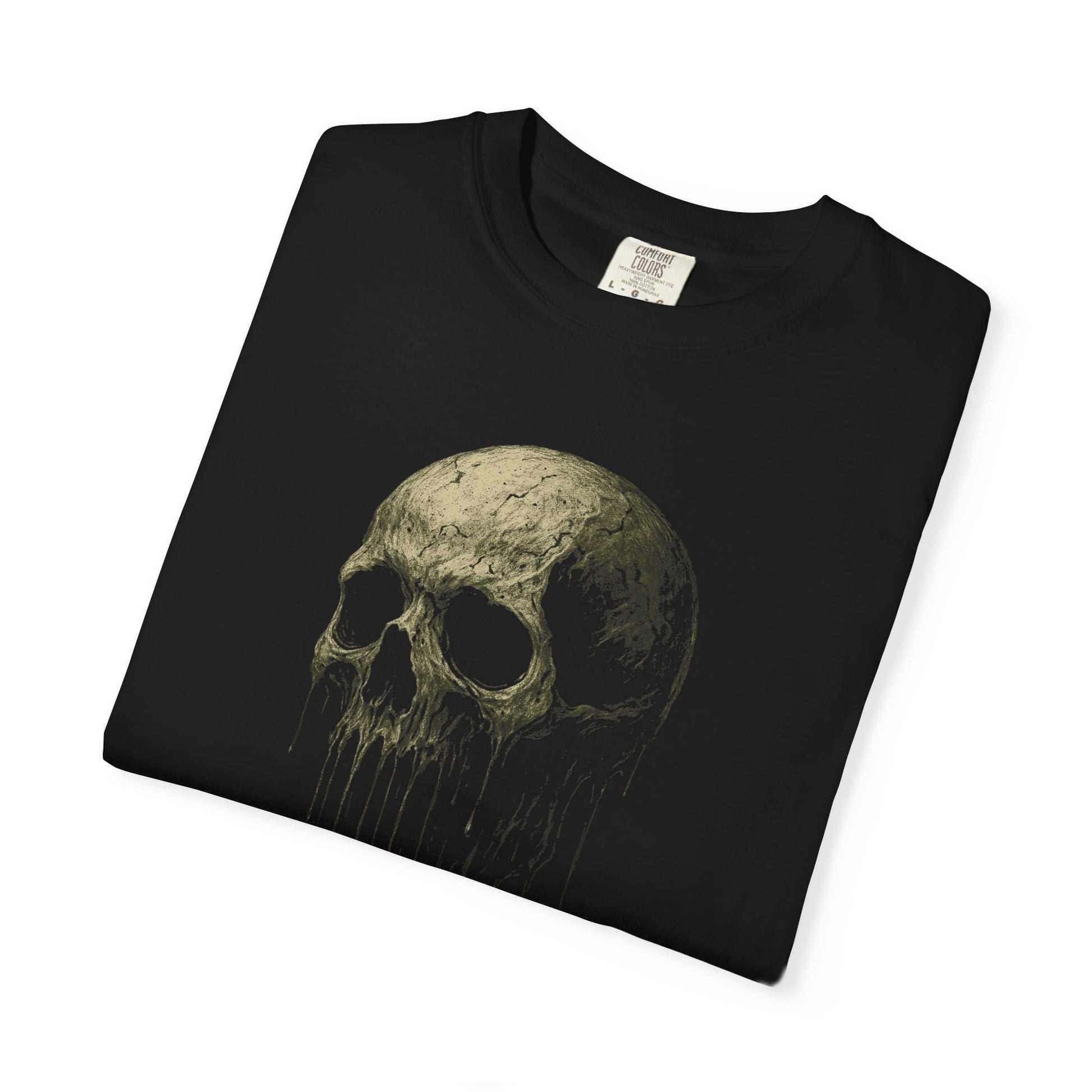 Upclose of a Distorted skull melting downward in a surreal, time-warped style on a black Comfort Colors t-shirt.