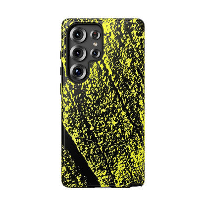 A protective phone case featuring a high-contrast black and neon yellow abstract paint splatter pattern, shown on a plain white background.