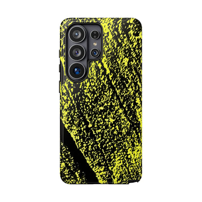 A protective phone case with a high-contrast black and neon yellow abstract paint splatter pattern, shown on a white background.