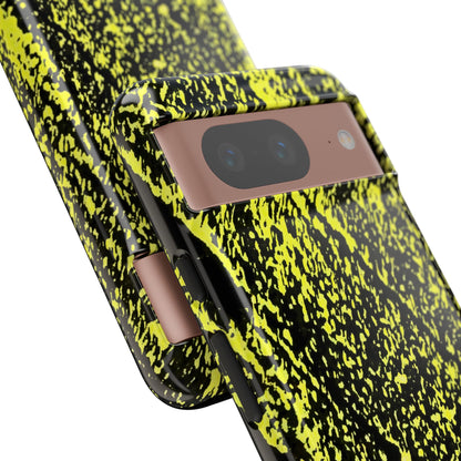 A close-up of a smartphone case with a high-contrast neon yellow and black splatter pattern, shown fitted on a phone against a plain white background.