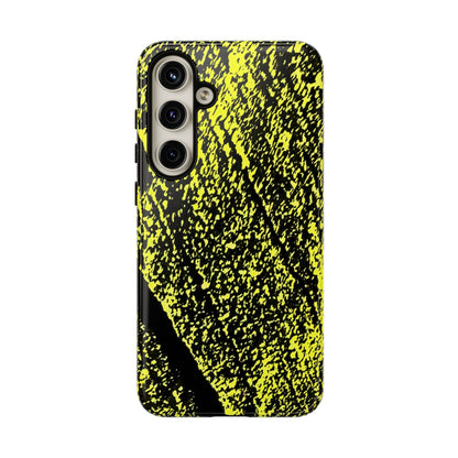 A protective phone case featuring a high-contrast black and neon yellow splattered paint pattern, shown on a plain white background.