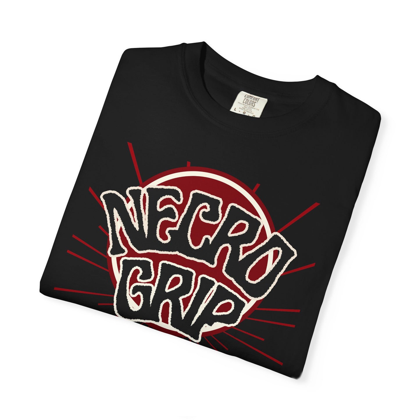 Folded black NECRO BURST Comfort Colors t-shirt showing close-up of red eclipse NecroGrip logo and crimson burst lines.