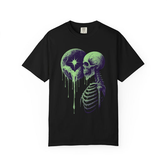 Black Comfort Colors t-shirt with a green skeleton and dripping moon graphic from NecroGrip, front-facing product mockup on plain background.