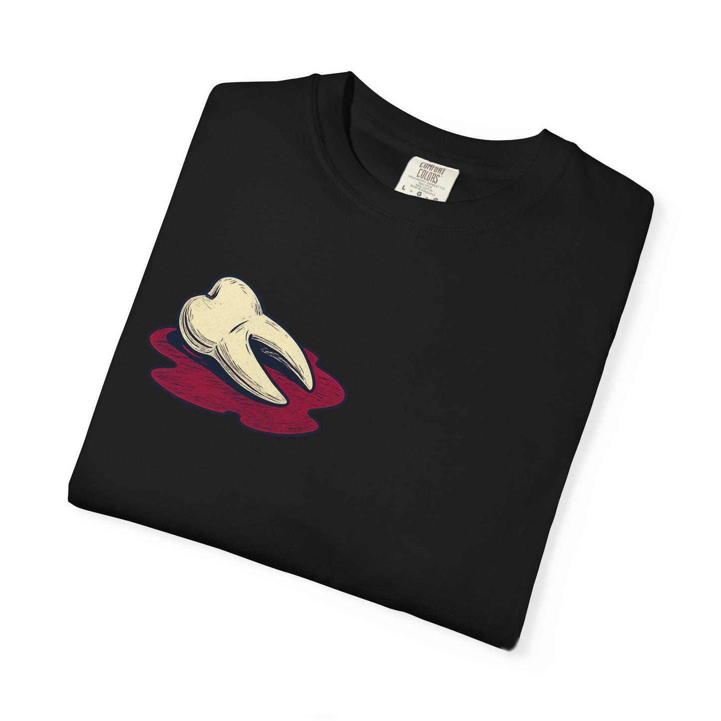 Folded black Comfort Colors t-shirt showing the EXTRACTED graphic, distressed tooth artwork with deep red accent, printed on soft heavyweight cotton.