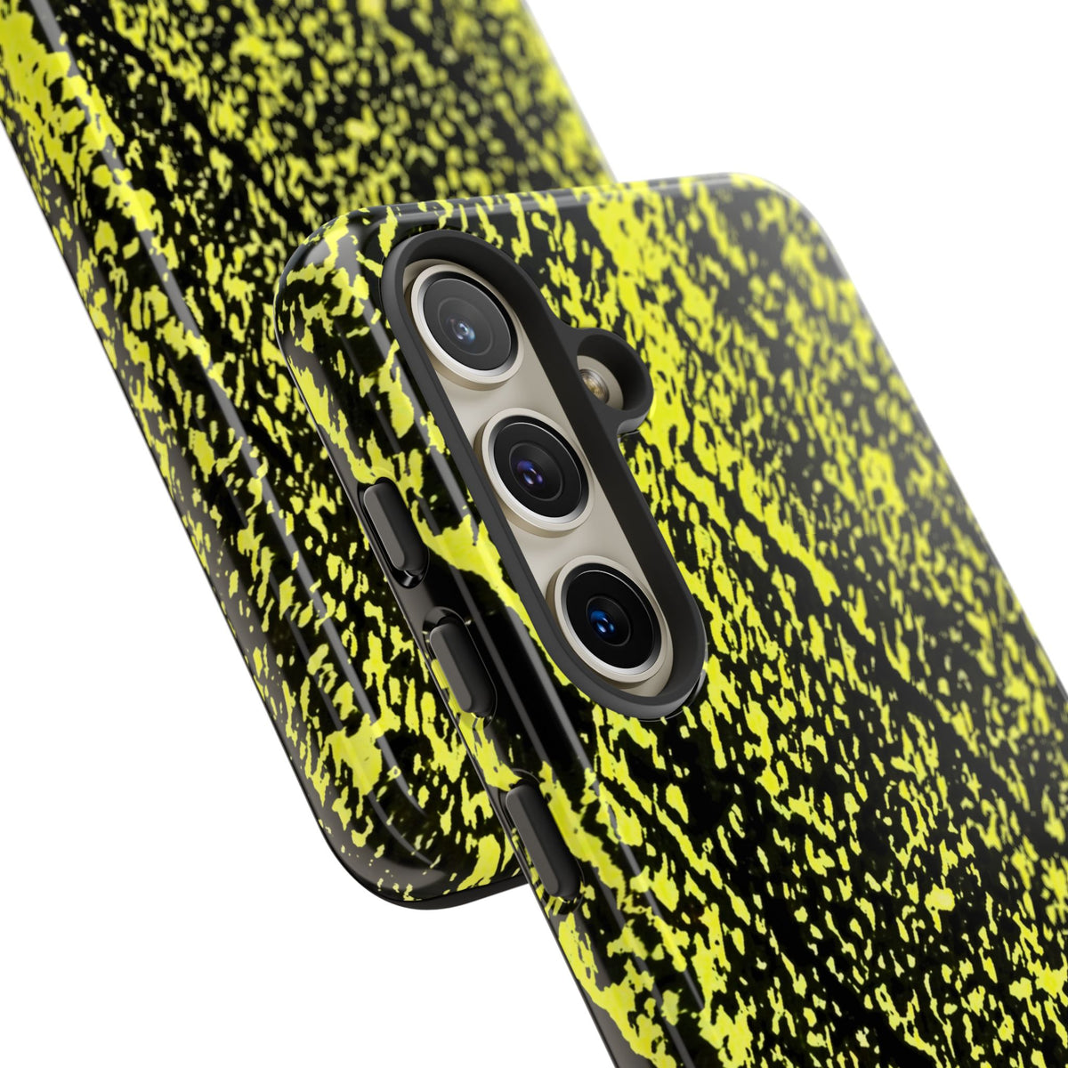 A close-up of a smartphone case with a black and neon yellow splatter pattern, shown from the back with the camera cutout visible, on a plain white background.