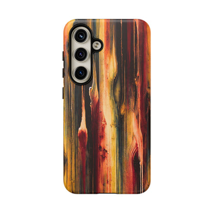 Rupture by NecroGrip tough phone case with red, gold, and black drip design