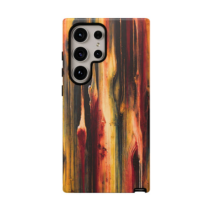 Rupture by NecroGrip tough phone case with red, gold, and black drip design