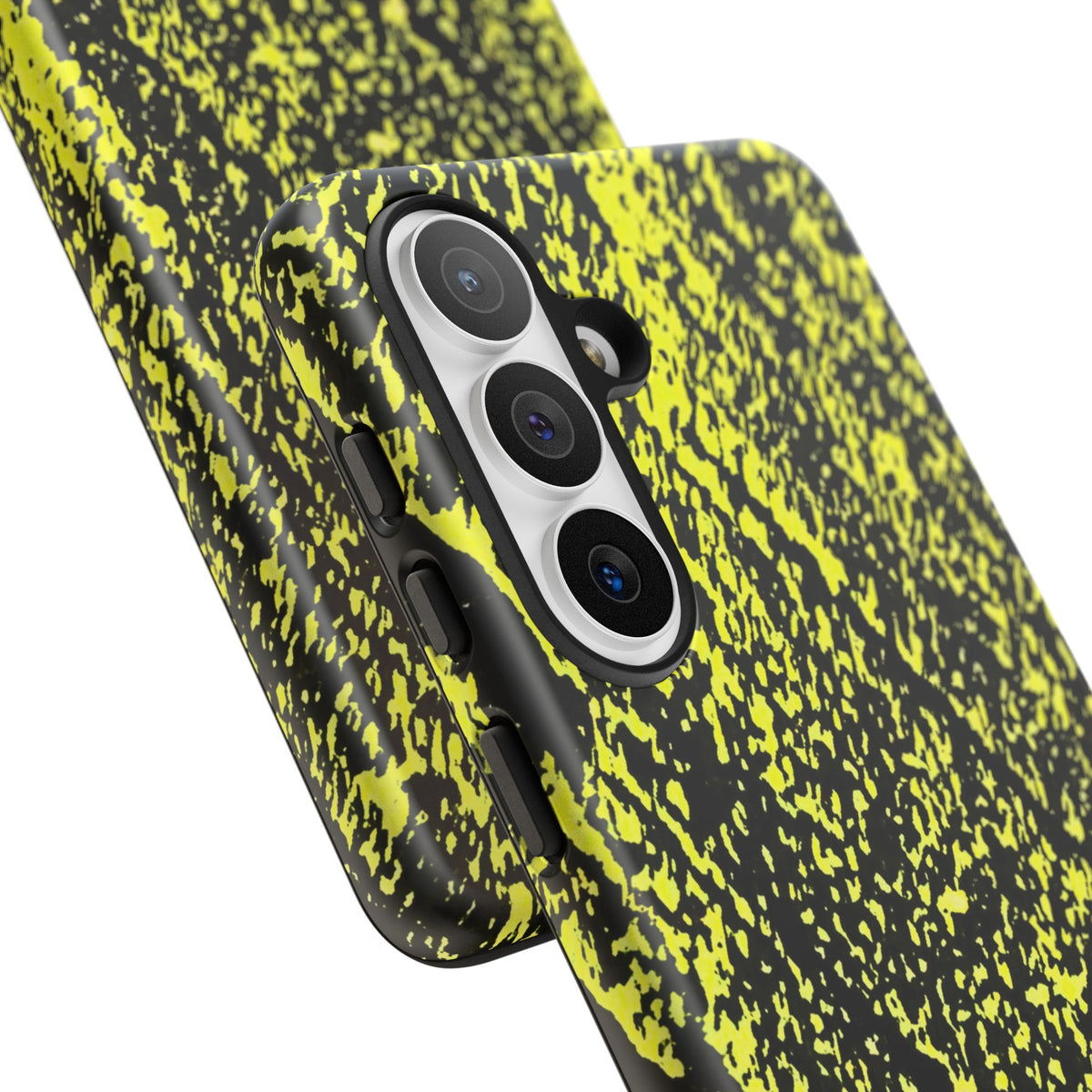 A close-up of a smartphone case with a black and neon yellow splatter pattern, fitted on a phone with a triple-camera system, shown against a plain white background.