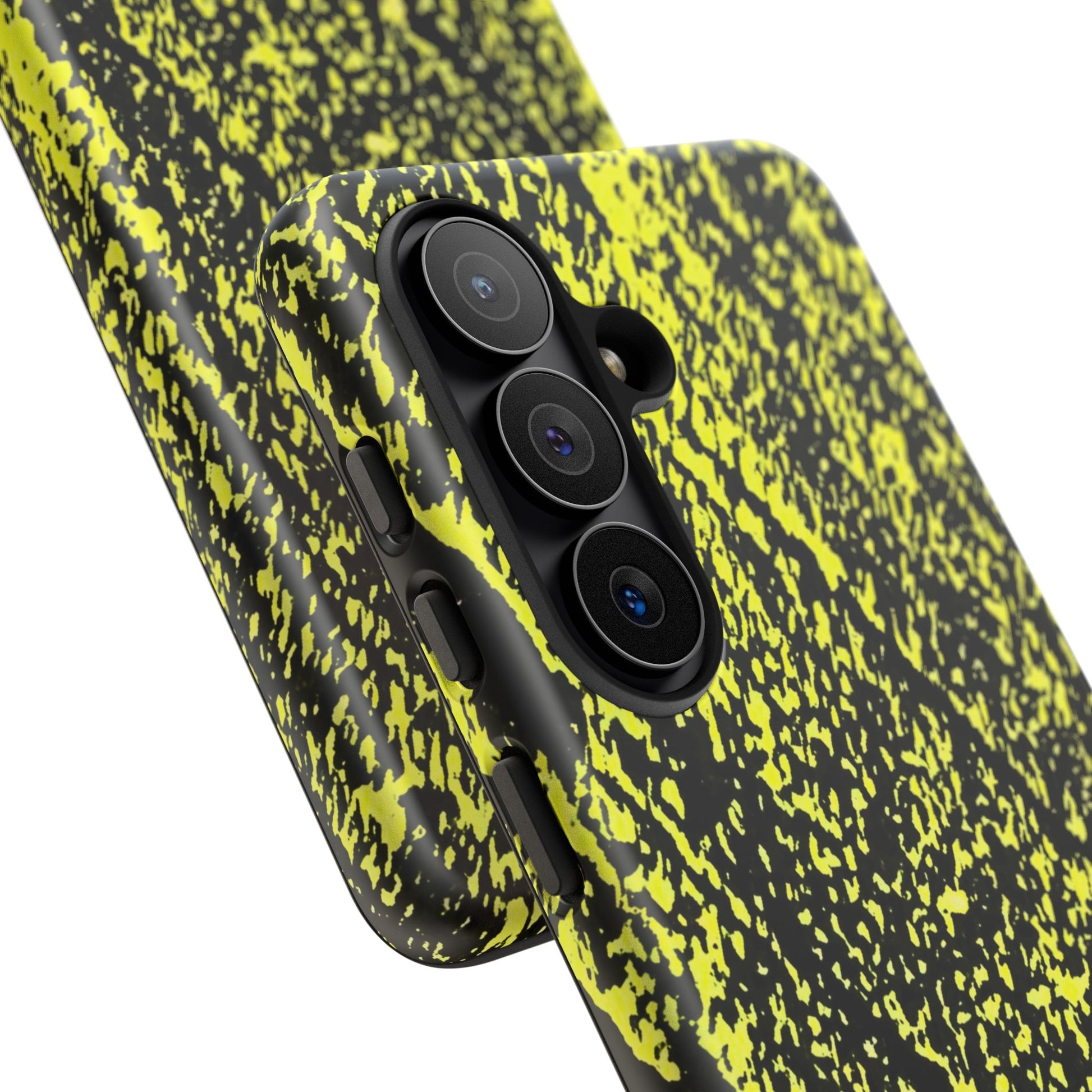 Close-up of a smartphone case with a black and neon yellow splatter pattern, fitted on a phone with a triple-camera system, shown against a plain white background.