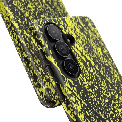 Close-up of a smartphone case with a black and neon yellow splatter pattern, fitted on a phone with a triple-camera system, shown against a plain white background.