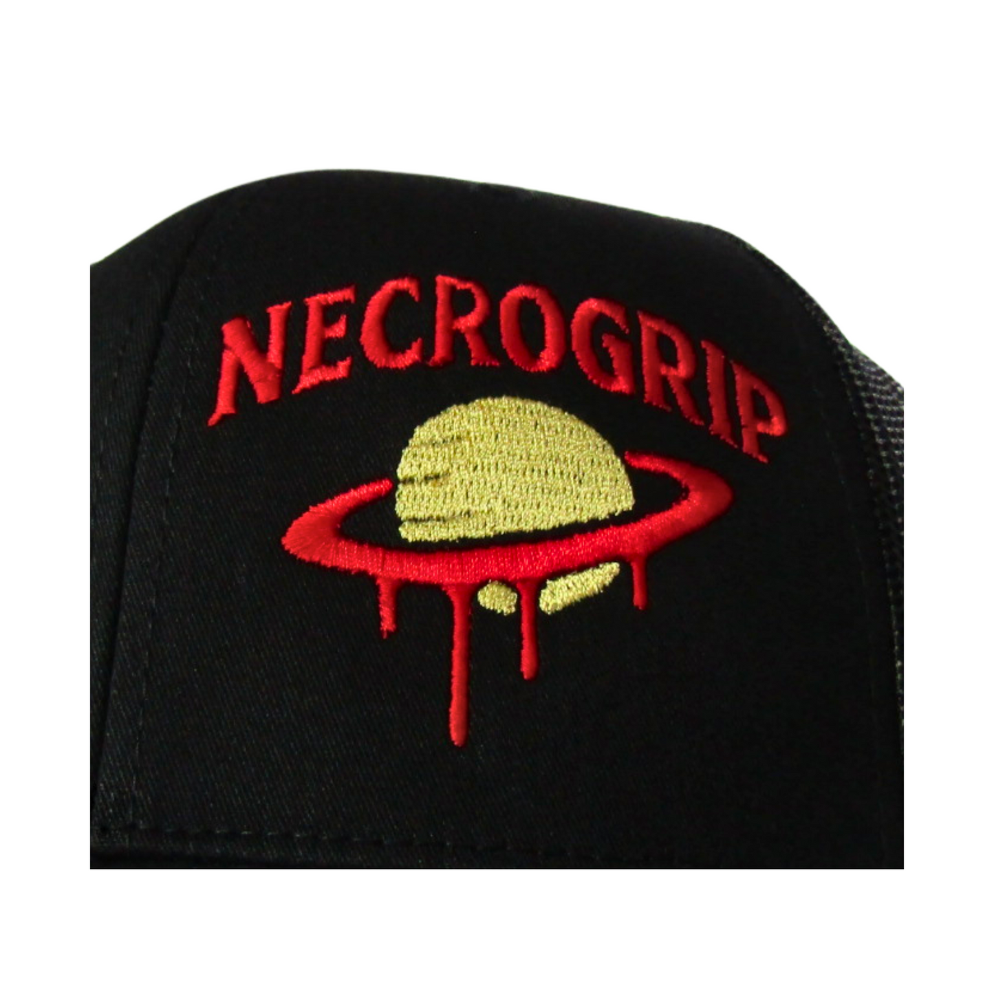 Close-up of NecroGrip hat embroidery, yellow Saturn with red dripping rings stitched on black fabric