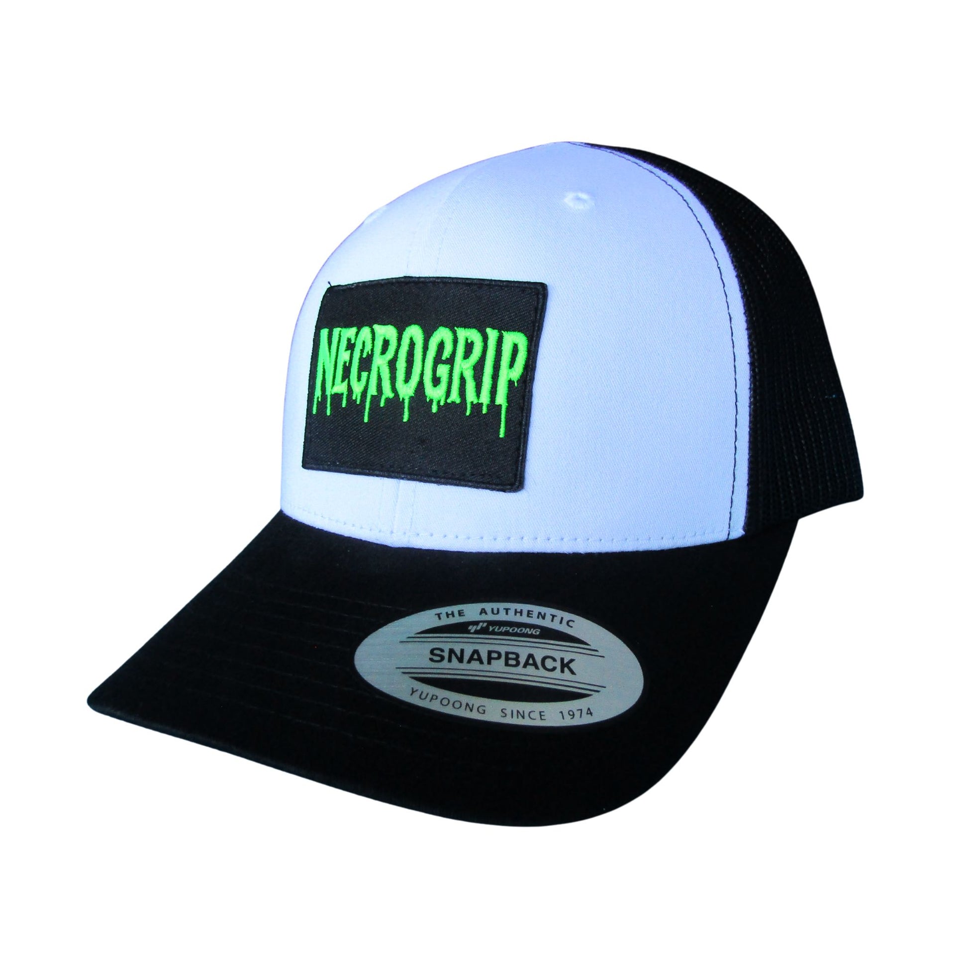 Angled view of black snapback cap featuring sewn NECROGRIP logo patch in neon green, adjustable mesh back visible.