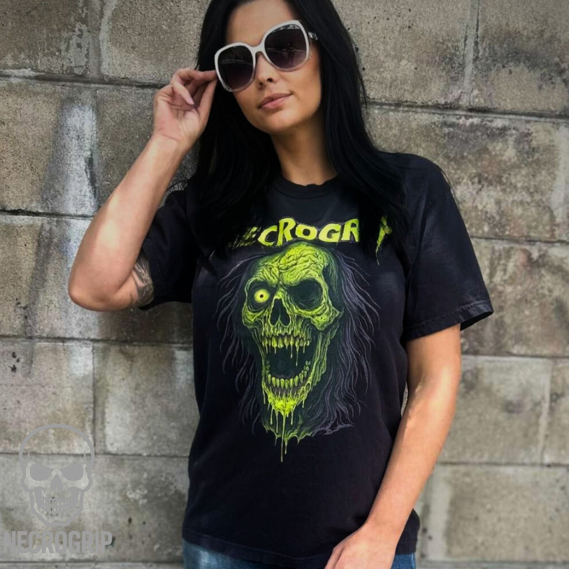 Customer in NecroGrip Rotface tee featuring a neon green zombie face on vintage black Comfort Colors.