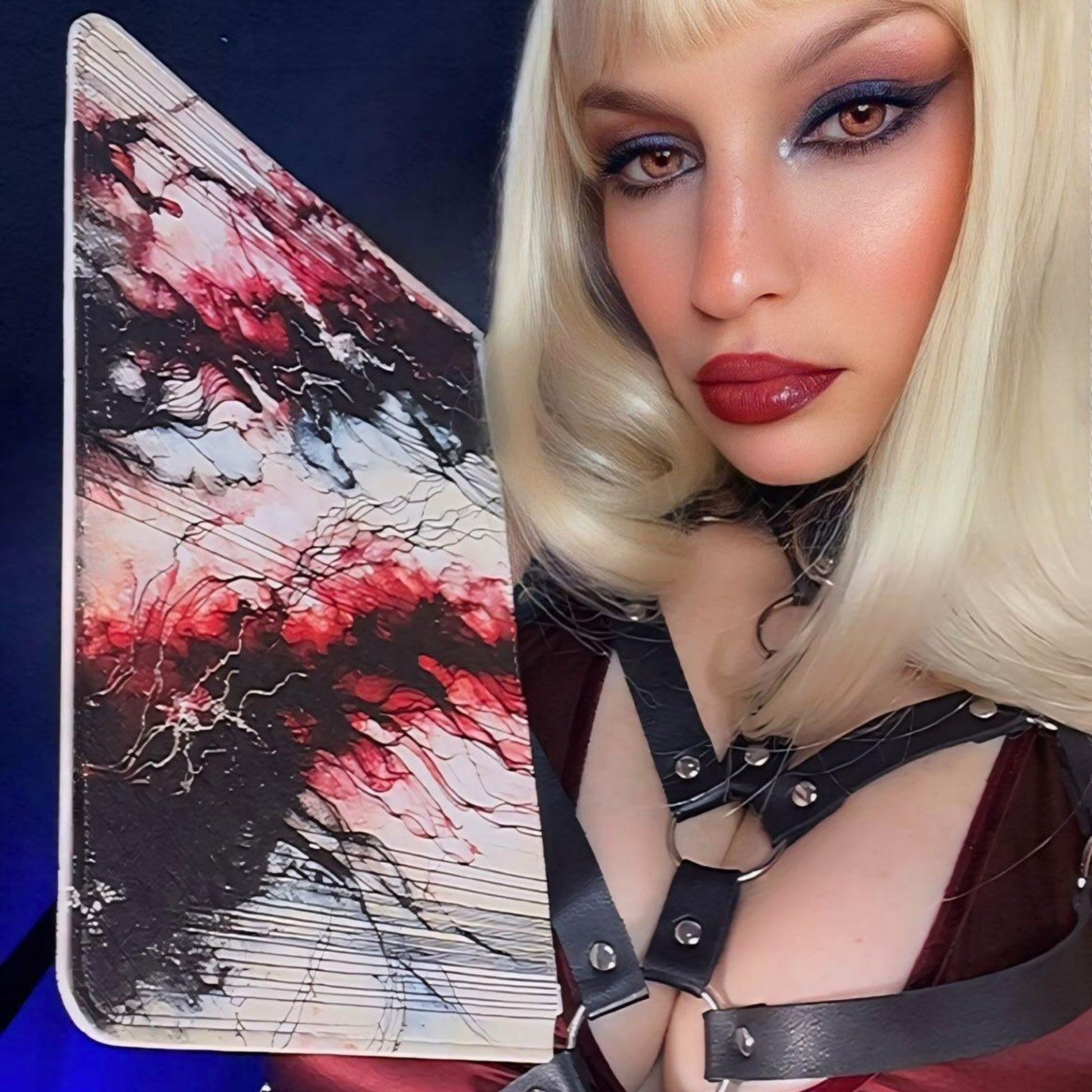 Rock & Roll Queen holding the Atramentum NecroGrip Clutch Bag.